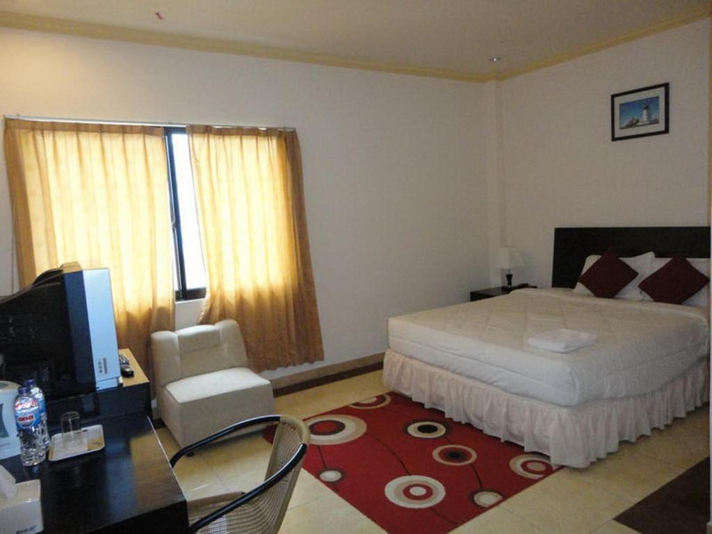 Grand Duta Hotel Palu Rum bild